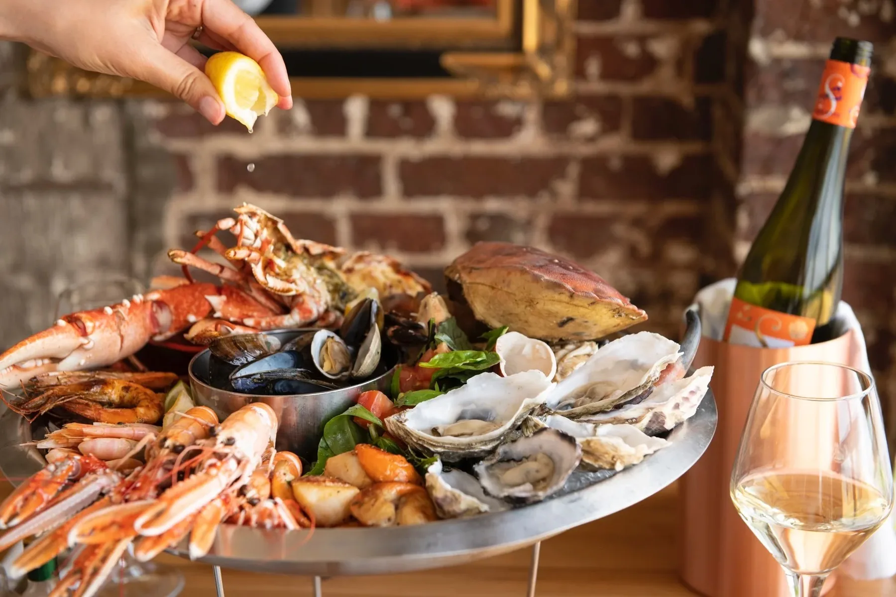 The seafood sharing platter: whole lobster, crab, oysters, mussels, prawns and clams on ice